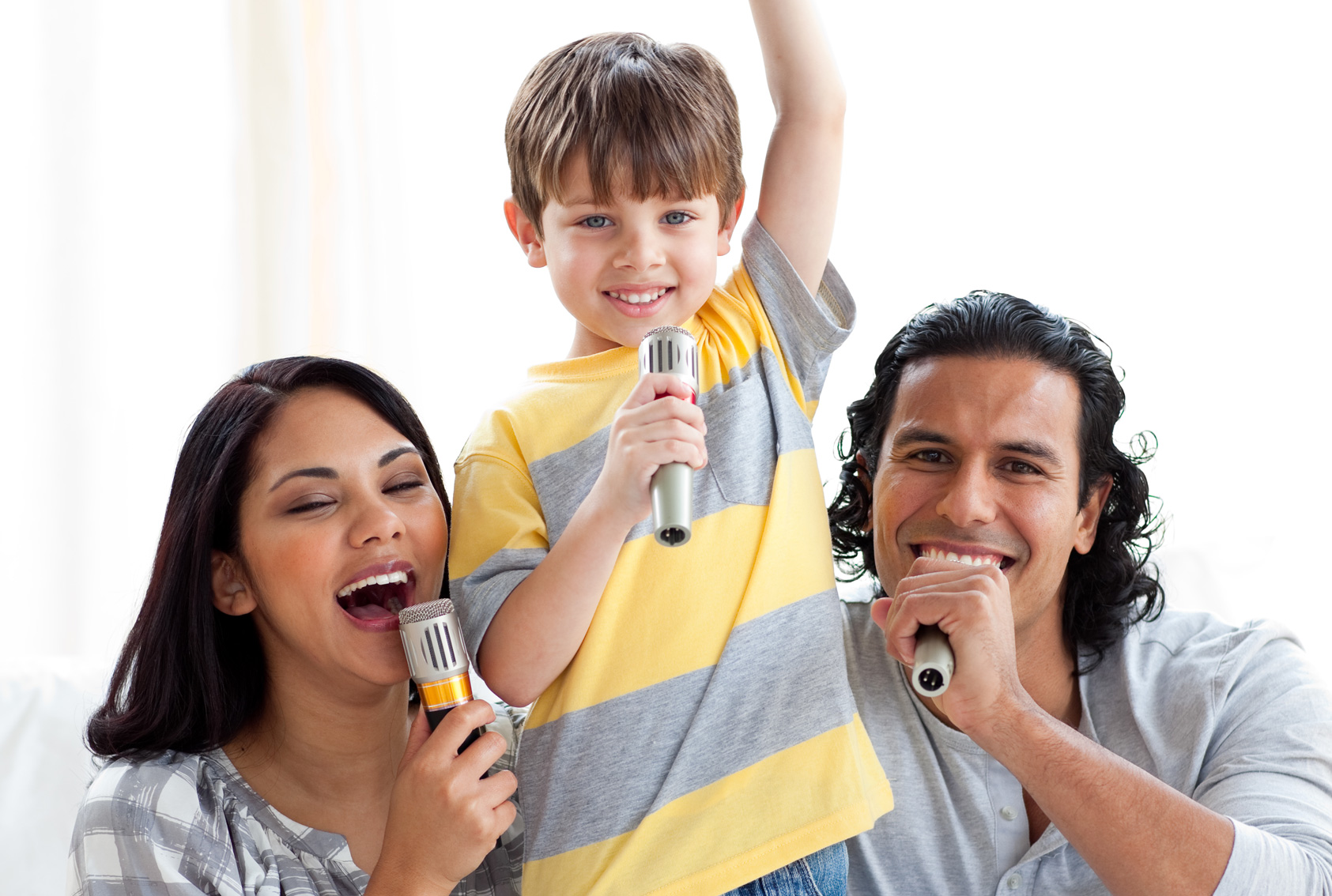 Boy Singing Karaoke With Parents