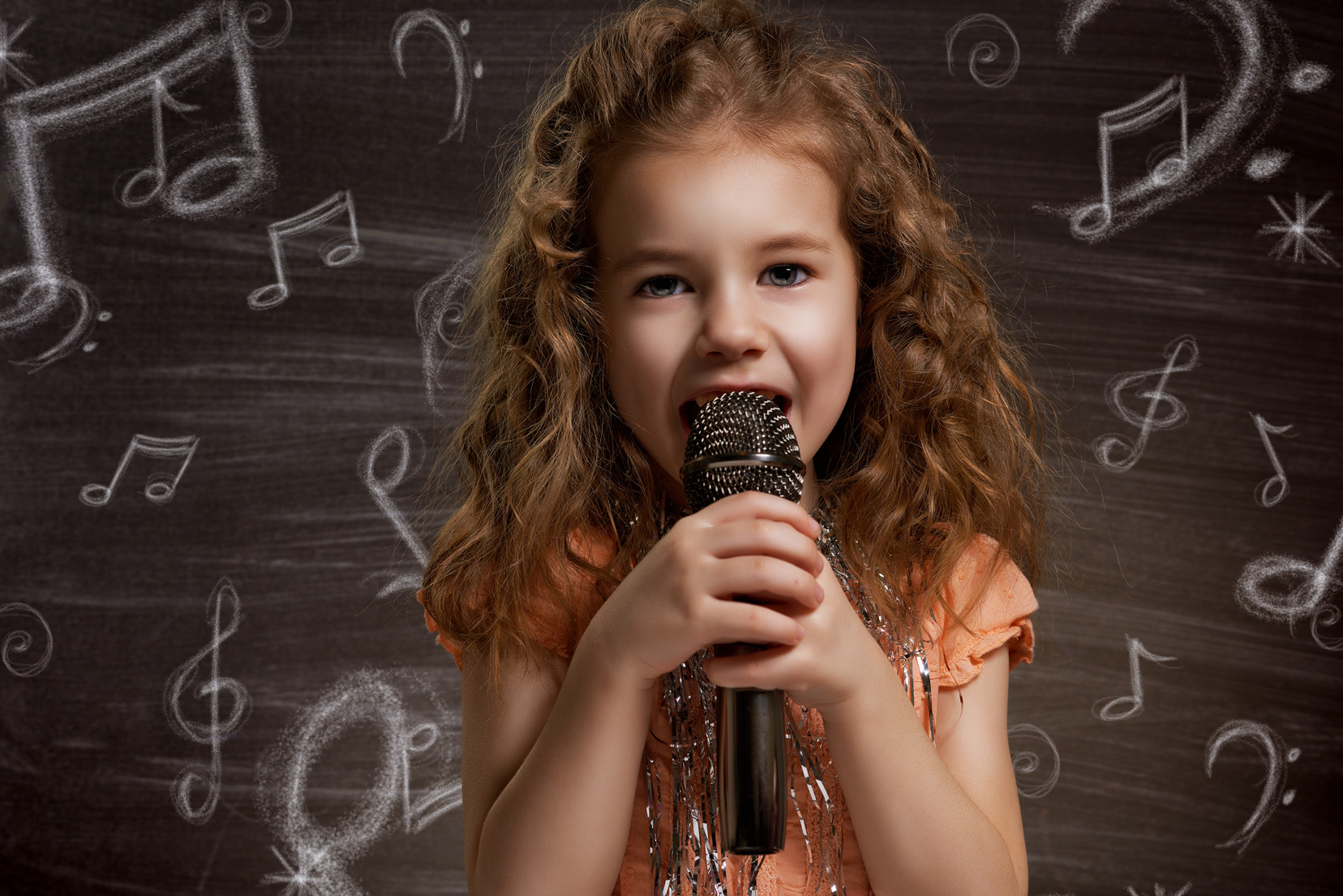 Young Girl Singing with Microphone